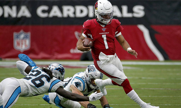 Arizona Cardinals quarterback Kyler Murray (1) runs as Carolina Panthers cornerback Donte Jackson (...