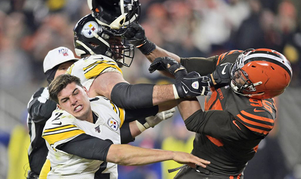 Cleveland Browns defensive end Myles Garrett (95) hits Pittsburgh Steelers quarterback Mason Rudolp...