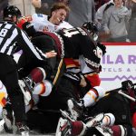GLENDALE, ARIZONA - NOVEMBER 16: Carl Soderberg #34 of the Arizona Coyotes jumps on the pile as Matthew Tkachuk #19 of the Calgary Flames takes part in a scuffle during the second period at Gila River Arena on November 16, 2019 in Glendale, Arizona. (Photo by Norm Hall/NHLI via Getty Images)