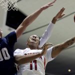 Arizona forward Ira Lee, right, shoots next to Pennsylvania guard Ryan Betley, left, during the first half of an NCAA college basketball game at the Wooden Legacy tournament in Anaheim, Calif., Friday, Nov. 29, 2019. (AP Photo/Alex Gallardo)