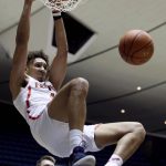 Arizona center Chase Jeter dunks in front of Pennsylvania guard Ryan Betley during the first half of an NCAA college basketball game at the Wooden Legacy tournament in Anaheim, Calif., Friday, Nov. 29, 2019. (AP Photo/Alex Gallardo)