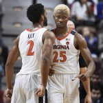 Virginia's Mamadi Diakite (25) reacts with teammate Braxton Key (2) after Diakite was fouled while scoring a basket during the second half of an NCAA college basketball game against Arizona State, Sunday, Nov. 24, 2019, in Uncasville, Conn. (AP Photo/Jessica Hill)