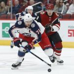 Columbus Blue Jackets left wing Nick Foligno (71) skates away from Arizona Coyotes center Clayton Keller in the first period during an NHL hockey game, Thursday, Nov. 7, 2019, in Glendale, Ariz. (AP Photo/Rick Scuteri)