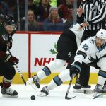 Arizona Coyotes center Phil Kessel (81) beats San Jose Sharks center Barclay Goodrow (23) to the puck as Coyotes center Carl Soderberg (34) looks on during the first period of an NHL hockey game Saturday, Nov. 30, 2019, in Glendale, Ariz. (AP Photo/Ross D. Franklin)