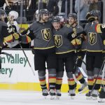 Vegas Golden Knights right wing Alex Tuch, second from left, is congratulated after scoring during the shootout against the Arizona Coyotes in an NHL hockey game Friday, Nov. 29, 2019, in Las Vegas. (AP Photo/John Locher)