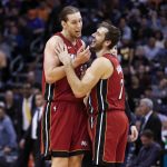 Miami Heat's Kelly Olynyk (9) and Goran Dragic (7) have a little fun as they celebrate the Heat's big lead over he Phoenix Suns during the second half of an NBA basketball game Thursday, Nov. 7, 2019, in Phoenix. (AP Photo/Darryl Webb)