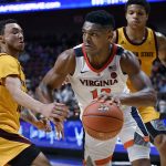 Virginia's Casey Morsell, right, dribbles around Arizona State's Jaelen House, left, during the second half of an NCAA college basketball game, Sunday, Nov. 24, 2019, in Uncasville, Conn. (AP Photo/Jessica Hill)
