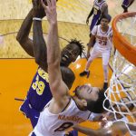 Los Angeles Lakers center Dwight Howard (39) shoots over Phoenix Suns forward Frank Kaminsky (8) during the second half during an NBA basketball game Tuesday, Nov. 12, 2019, in Phoenix. (AP Photo/Rick Scuteri)