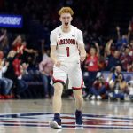 Arizona guard Nico Mannion reacts after making a defensive stop against Illinois during the first half of an NCAA college basketball game Sunday, Nov. 10, 2019, in Tucson, Ariz. (AP Photo/Rick Scuteri)