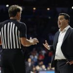 Arizona head coach Sean Miller, right, talks to official John Higgins in the second half during an NCAA college basketball game against New Mexico State, Sunday, Nov. 17, 2019, in Tucson, Ariz. (AP Photo/Rick Scuteri)