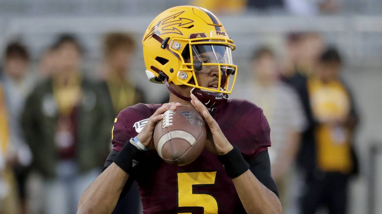Arizona State quarterback Jayden Daniels (5) warms up for the team's NCAA college football game aga...