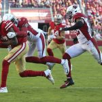 San Francisco 49ers wide receiver Emmanuel Sanders, left, catches a pass against Arizona Cardinals strong safety Jalen Thompson (34) and strong safety Budda Baker (32) during the second half of an NFL football game in Santa Clara, Calif., Sunday, Nov. 17, 2019. (AP Photo/John Hefti)