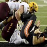 Oregon State quarterback Jake Luton (6) is sacked by Arizona State defensive linemen Jermayne Lole and Roe Wilkins during the first half of an NCAA college football game in Corvallis, Ore., Saturday, Nov. 16, 2019. (AP Photo/Steve Dykes)