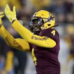 Arizona State's Evan Fields (4) pumps up the crowd after stopping Arizona on a fourth down play in the first half of an NCAA college football game, Saturday, Nov. 30, 2019, in Tempe, Ariz. (AP Photo/Darryl Webb)