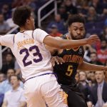 Atlanta Hawks forward Jabari Parker (5) fouls Phoenix Suns forward Cameron Johnson (23) during the first half of an NBA basketball game Thursday, Nov. 14, 2019, in Phoenix. (AP Photo/Matt York)
