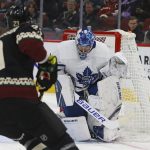 Toronto Maple Leafs goaltender Frederik Andersen, right, makes a save on a shot by Arizona Coyotes defenseman Oliver Ekman-Larsson (23) during the first period of an NHL hockey game Thursday, Nov. 21, 2019, in Glendale, Ariz. (AP Photo/Ross D. Franklin)