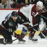 Arizona Coyotes defenseman Jason Demers (55) looks to control the puck as he collides with Colorado Avalanche right wing Joonas Donskoi (72) during the second period of an NHL hockey game Saturday, Nov. 2, 2019, in Glendale, Ariz. (AP Photo/Ross D. Franklin)