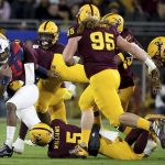 Arizona State defenders chase Arizona's Darrius Smith (20) during the first half of an NCAA college football game, Saturday, Nov. 30, 2019, in Tempe, Ariz. (AP Photo/Darryl Webb)