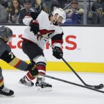 Arizona Coyotes right wing Brad Richardson (15) shoots around Vegas Golden Knights center William Karlsson (71) during the first period of an NHL hockey game Friday, Nov. 29, 2019, in Las Vegas. (AP Photo/John Locher)