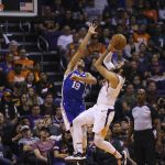 Phoenix Suns guard Ricky Rubio, center right, shoots over Philadelphia 76ers guard Raul Neto (19) during the first half of an NBA basketball game Monday, Nov. 4, 2019, in Phoenix. (AP Photo/Ross D. Franklin)