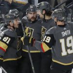 Vegas Golden Knights celebrate after Alex Tuch, center, scored against the Arizona Coyotes during the second period of an NHL hockey game Friday, Nov. 29, 2019, in Las Vegas. (AP Photo/John Locher)