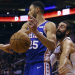 Phoenix Suns guard Ricky Rubio, right, strips the ball from Philadelphia 76ers guard Ben Simmons (25) during the first half of an NBA basketball game Monday, Nov. 4, 2019, in Phoenix. (AP Photo/Ross D. Franklin)