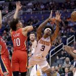 Phoenix Suns forward Kelly Oubre Jr. (3) loses the ball as New Orleans Pelicans center Jaxson Hayes (10) defends during the second half of an NBA basketball game Thursday, Nov. 21, 2019, in Phoenix. (AP Photo/Matt York)