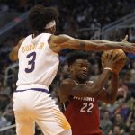 Phoenix Suns' Kelly Oubre Jr. (3) plays tough defense against Miami Heat's Jimmy Butler (22) during the first half of an NBA basketball game Thursday, Nov. 7, 2019, in Phoenix. (AP Photo/Darryl Webb)