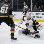 Arizona Coyotes goaltender Darcy Kuemper (35) makes a save against Vegas Golden Knights right wing Mark Stone (61) during the second period of an NHL hockey game Friday, Nov. 29, 2019, in Las Vegas. (AP Photo/John Locher)