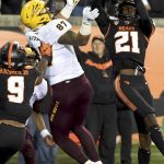 Oregon State defensive back Nahshon Wright, right, intercepts a pass on a 2-point conversion attempt, in front of Arizona State tight end Tommy Hudson, middle, as linebacker Hamilcar Rashed Jr. closes in during the second half of an NCAA college football game in Corvallis, Ore., Saturday, Nov. 16, 2019. Oregon State won 35-34. (AP Photo/Steve Dykes)