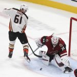 Arizona Coyotes goalie Darcy Kuemper (35) saves a shot against the Anaheim Ducks' Tory Terry (61) during the second period of an NHL hockey game Wednesday, Nov. 27, 2019, in Glendale, Ariz. (AP Photo/Darryl Webb)