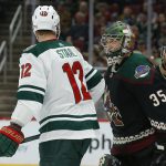 Minnesota Wild center Eric Staal (12) and Arizona Coyotes goaltender Darcy Kuemper (35) talk in the first period during an NHL hockey game, Saturday, Nov. 9, 2019, in Glendale, Ariz. (AP Photo/Rick Scuteri)