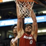 Phoenix Suns' Kelly Oubre Jr., left, blocks Miami Heat's Meyers Leonard (0) shot during the first half of an NBA basketball game Thursday, Nov. 7, 2019, in Phoenix. (AP Photo/Darryl Webb)