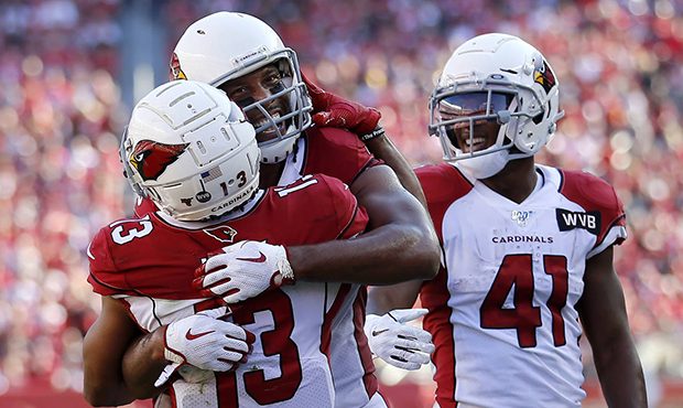 Arizona Cardinals wide receiver Larry Fitzgerald, center, celebrates with wide receiver Christian K...