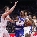 Sacramento Kings guard Buddy Hield, right, goes to the basket against Phoenix Suns forward Frank Kaminsky, left, during the first quarter of an NBA basketball game in Sacramento, Calif., Tuesday, Nov. 19, 2019. (AP Photo/Rich Pedroncelli)