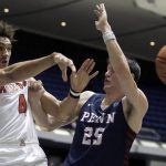 Arizona center Chase Jeter, left, passes the ball away from Pennsylvania forward AJ Brodeur during the first half of an NCAA college basketball game at the Wooden Legacy tournament in Anaheim, Calif., Friday, Nov. 29, 2019. (AP Photo/Alex Gallardo)