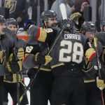 Vegas Golden Knights right wing Alex Tuch, center, celebrates after scoring against the Arizona Coyotes in the shootout of an NHL hockey game Friday, Nov. 29, 2019, in Las Vegas. (AP Photo/John Locher)