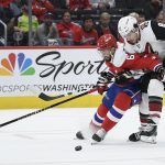 Washington Capitals defenseman Michal Kempny (6), of the Czech Republic, battles for the puck against Arizona Coyotes center Nick Schmaltz (8) during the first period of an NHL hockey game, Monday, Nov. 11, 2019, in Washington. (AP Photo/Nick Wass)