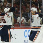 Edmonton Oilers right wing Alex Chiasson, right, celebrates his goal against the Arizona Coyotes with center Sam Gagner (89) during the second period of an NHL hockey game Sunday, Nov. 24, 2019, in Glendale, Ariz. (AP Photo/Ross D. Franklin)