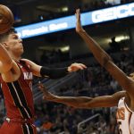 Miami Heat's Tyler Herro (14) drives to the lane against Phoenix Suns' Mikal Bridges (25) during the first half of an NBA basketball game Thursday, Nov. 7, 2019, in Phoenix. (AP Photo/Darryl Webb)