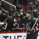 Arizona Coyotes center Phil Kessel, right, celebrates his goal against the Colorado Avalanche with Coyotes center Clayton Keller, left, and Coyotes right wing Conor Garland (83) during the first period of an NHL hockey game Saturday, Nov. 2, 2019, in Glendale, Ariz. (AP Photo/Ross D. Franklin)