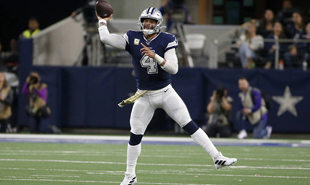 Dallas Cowboys quarterback Dak Prescott throws a pass during the first half of the team's NFL footb...