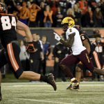 Arizona State wide receiver Brandon Aiyuk runs a punt back for a touchdown as Oregon State tight end Teagan Quitoriano gives chase during the first half of an NCAA college football game in Corvallis, Ore., Saturday, Nov. 16, 2019. (AP Photo/Steve Dykes)