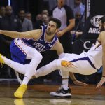 Philadelphia 76ers guard Furkan Korkmaz, left, loses the ball as he runs into Phoenix Suns guard Ricky Rubio during the second half of an NBA basketball game, Monday, Nov. 4, 2019, in Phoenix. The Suns defeated the 76ers 114-109. (AP Photo/Ross D. Franklin)