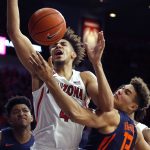 Arizona center Chase Jeter (4) gets fouled by Illinois forward Benjamin Bosmans-Verdonk (13) during the second half of an NCAA college basketball game Sunday, Nov. 10, 2019, in Tucson, Ariz. (AP Photo/Rick Scuteri)