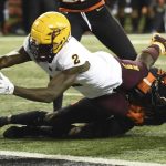 Arizona State wide receiver Brandon Aiyuk dives into the end zone as Oregon State defensive back Nahshon Wright tries to tackle him during the second half of an NCAA college football game in Corvallis, Ore., Saturday, Nov. 16, 2019. Oregon State won 35-34. (AP Photo/Steve Dykes)