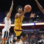 Arizona State's Remy Martin, center, shoots between Virginia's Kihei Clark, left, and Virginia's Mamadi Diakite, right, during the first half of an NCAA college basketball game, Sunday, Nov. 24, 2019, in Uncasville, Conn. (AP Photo/Jessica Hill)