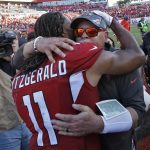 Arizona Cardinals wide receiver Larry Fitzgerald (11) hugs Tampa Bay Buccaneers head coach Bruce Arians after an NFL football game Sunday, Nov. 10, 2019, in Tampa, Fla. Arians is a former Cardinals head coach. (AP Photo/Mark LoMoglio)