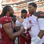 Arizona Cardinals wide receiver Larry Fitzgerald (11) shakes hands with Tampa Bay Buccaneers quarterback Jameis Winston (3) after an NFL football game Sunday, Nov. 10, 2019, in Tampa, Fla. (AP Photo/Jason Behnken)