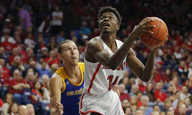 Arizona guard Devonaire Doutrive (14) looks to the basket as San Jose State guard Brae Ivey defends...